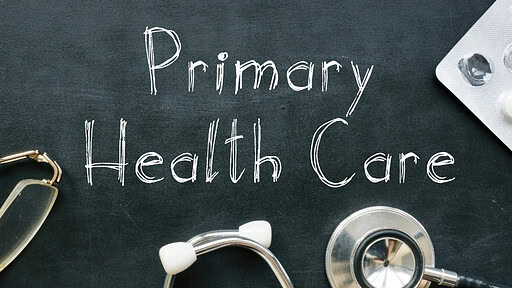 Primary Health Care written on chalkboard with stethescope