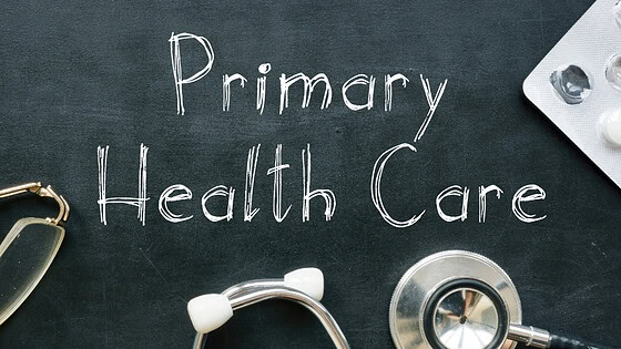 Primary Health Care written on chalkboard with stethescope