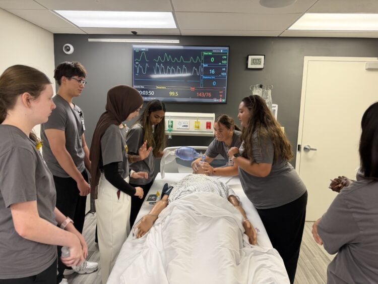 The MASH Camp at Rogers allowed students to resuscitate a manikin and check its vital signs on a screen.