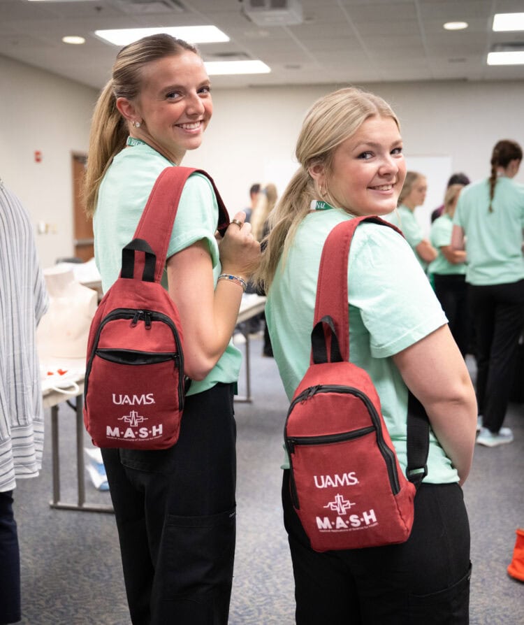 Two students with MASH backpacks.