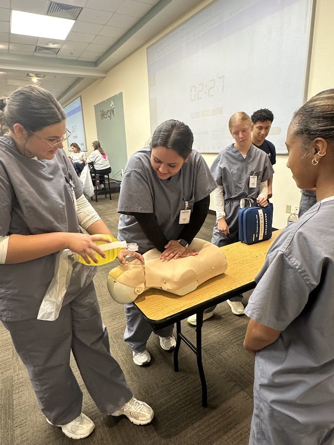 MASH campers learn about resuscitating a manikin at Fort Smith Mercy.