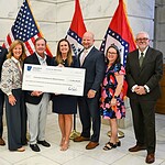 Arkansas Gov. Sarah Huckabee Sanders (center right) awards UAMS $11.9 million from the Arkansas Rural Health Transformation Program.