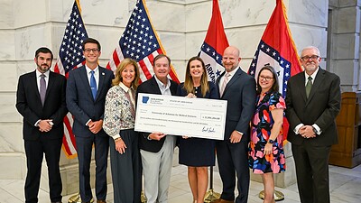 Arkansas Gov. Sarah Huckabee Sanders (center right) awards UAMS $11.9 million from the Arkansas Rural Health Transformation Program.