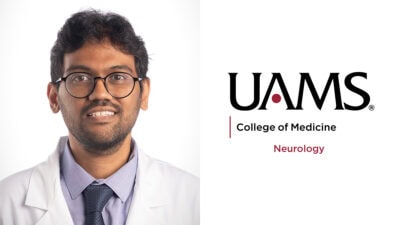 white-coat portrait beside UAMS logo