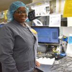Sterile processing intern Kyndall Owens assembles sets of instruments for use in surgical procedures at UAMS.