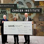Karlene Beams, Lois Callahan, and Michael Birrer, M.D., Ph.D. with donation check