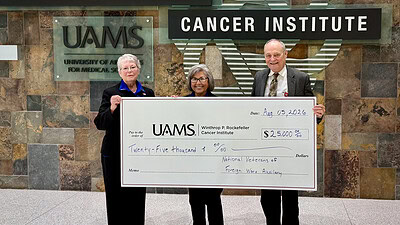 Karlene Beams, Lois Callahan, and Michael Birrer, M.D., Ph.D. with donation check