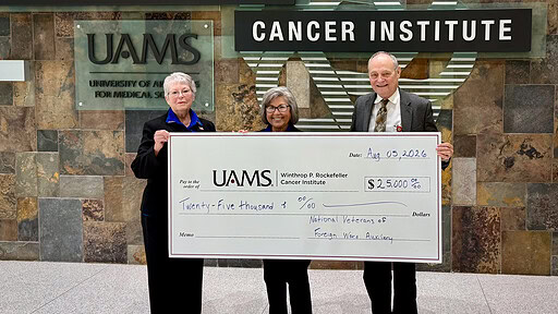 Karlene Beams, Lois Callahan, and Michael Birrer, M.D., Ph.D. with donation check