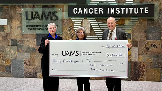 Karlene Beams, Lois Callahan, and Michael Birrer, M.D., Ph.D. with donation check