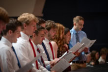 A close-up photo of seven students reciting the Medical Student Oath.