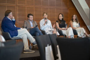 Roby Brock moderates a discussion with state lawmakers on maternal and infant health.