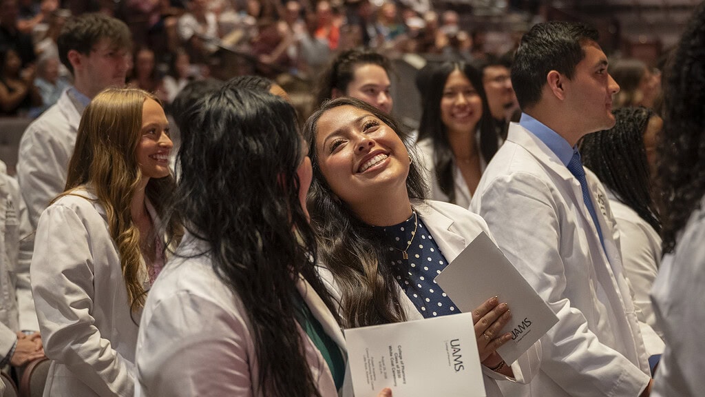 <p>Class of 2030 students Diana Hernandez (facing camera) and Maya Henderson (facing away) celebrate at the conclusion of their white coat ceremony.</p>
<div><a class="more" href="https://news.uams.edu/2026/09/02/college-of-pharmacy-class-of-2030-dons-white-coats/cop-white-coat-08282026-el2_5937/">Read more</a></div>