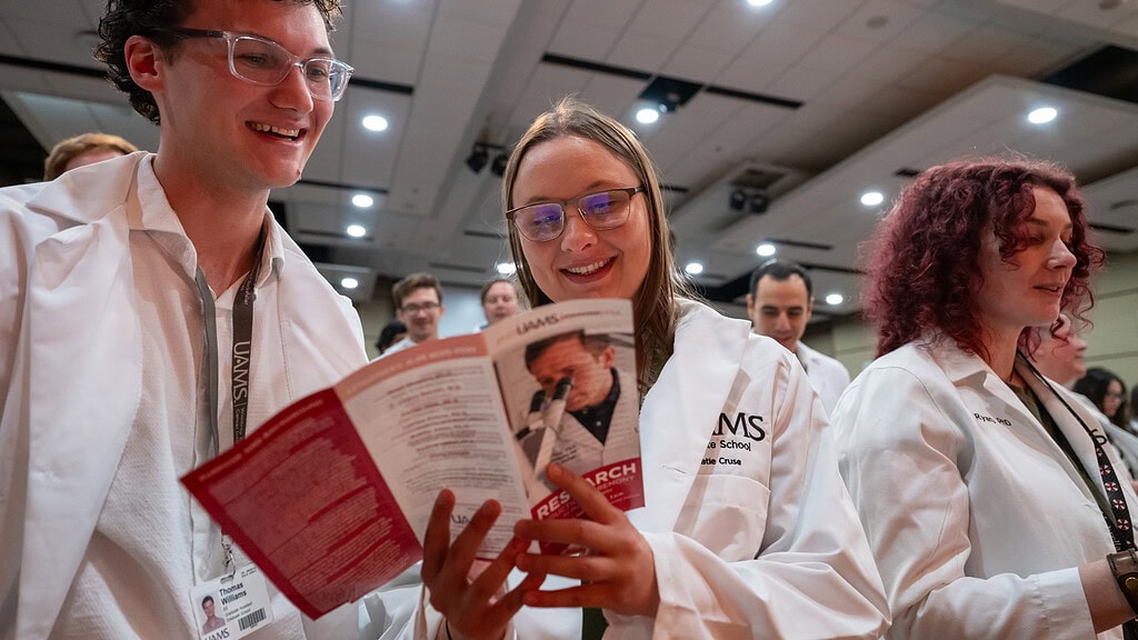 <p>Ph.D. candidates Thomas Williams and  Katie Cruse along with Katie Ryan, Ph.D., and others recite the Affirmation of Scientists during the Graduate School Research Induction Ceremony Sept. 10.</p>
<div><a class="more" href="https://news.uams.edu/2026/09/28/graduate-school-celebrates-next-group-of-ph-d-candidates/featured-3/">Read more</a></div>