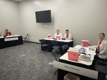 Employees and students from UAMS conducted a variety of screenings, including for blood pressure and glucose.