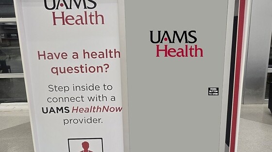 Front view of the UAMS Health telehealth booth at XNA airport.