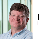 Portrait of William McClain with UAMS logo