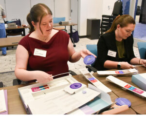 Allie McFarland practices inserting IUD in skills lab.
