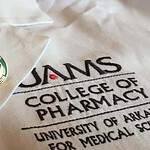 UAMS College of Pharmacy coat and pin