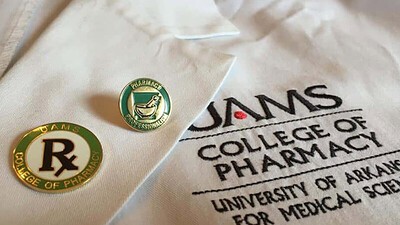 UAMS College of Pharmacy coat and pin