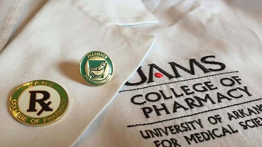 UAMS College of Pharmacy coat and pin