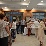 People gathered in the lobby of the UAMS Schmieding Center for Senior Health and Education