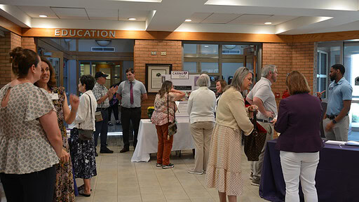 People gathered in the lobby of the UAMS Schmieding Center for Senior Health and Education