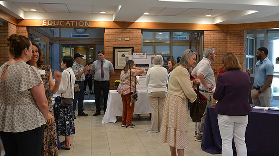 People gathered in the lobby of the UAMS Schmieding Center for Senior Health and Education