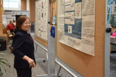 Jeanne Wei, M.D., Ph.D., professor and chair of the Department of Geriatrics and executive director of the Institute on Aging, looks at the research posters on display at the Geriatrics Updates conference.