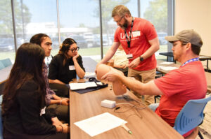 two instructors show how to inject a knee