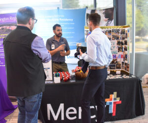 Students talk to representatives from Mercy residency.