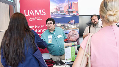 Members of UAMS North Central Regional Campus talk with medical students