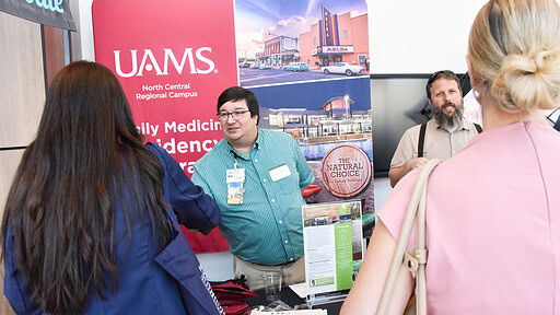 Members of UAMS North Central Regional Campus talk with medical students