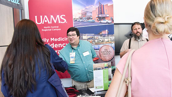 Members of UAMS North Central Regional Campus talk with medical students