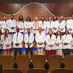 After the white coat ceremony, Respiratory Care students gather for group photo in Smith Auditorium. It was the first white coat ceremony for the program's students.