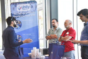 Student talks to Unity Health residency representatives.