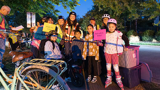 Students and parents get ready to participate in the annual Walk and Roll event in Springdale that encourages kids to walk or ride their bikes to school.