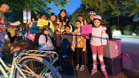 Students and parents get ready to participate in the annual Walk and Roll event in Springdale that encourages kids to walk or ride their bikes to school.